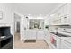 Well-equipped kitchen with white cabinets and quartz countertops at 6050 28Th W St # 14B, Bradenton, FL 34207