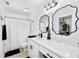 Clean bathroom with white vanity, quartz countertop, and walk-in shower at 6050 28Th W St # 14B, Bradenton, FL 34207
