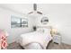 Guest bedroom with a queen-size bed, nightstand, and window at 6050 28Th W St # 14B, Bradenton, FL 34207
