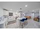 Bright white kitchen with island, stainless steel appliances, and quartz countertops at 3607 22Nd W Ave, Bradenton, FL 34205