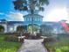 Community recreation center with a walkway and palm trees at 3832 Shimmering Oaks Dr, Parrish, FL 34219