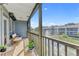 Screened balcony overlooking a tranquil pond with a fountain at 259 Fenwick Dr # 30, Venice, FL 34285