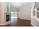 Bright living room with fireplace and sliding doors to the pool area at 13814 Nighthawk Ter, Lakewood Ranch, FL 34202