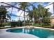 Inviting pool and spa with screened enclosure, overlooking a tranquil lake at 13814 Nighthawk Ter, Lakewood Ranch, FL 34202