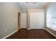 Bright bedroom with double door closet and wood floor at 13814 Nighthawk Ter, Lakewood Ranch, FL 34202