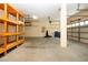 Garage with ample space, overhead storage, and room for two cars at 13814 Nighthawk Ter, Lakewood Ranch, FL 34202