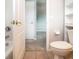 Bathroom with toilet, access to bedroom and additional closet at 13814 Nighthawk Ter, Lakewood Ranch, FL 34202