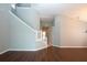 Bright entryway with hardwood floors and staircase leading to upper level at 13814 Nighthawk Ter, Lakewood Ranch, FL 34202