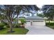 Two-story house with two-car garage and landscaping at 13814 Nighthawk Ter, Lakewood Ranch, FL 34202