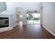 Open living room with pool view and fireplace at 13814 Nighthawk Ter, Lakewood Ranch, FL 34202