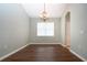 Elegant dining room with hardwood floors and a chandelier at 13814 Nighthawk Ter, Lakewood Ranch, FL 34202