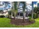 Well-manicured backyard featuring a screened pool and spa area at 13814 Nighthawk Ter, Lakewood Ranch, FL 34202