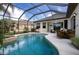 Inviting screened pool and spa with patio furniture at 13814 Nighthawk Ter, Lakewood Ranch, FL 34202
