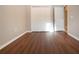 Empty bedroom with new wood-look flooring and double doors to closet at 13814 Nighthawk Ter, Lakewood Ranch, FL 34202