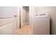 Laundry room featuring a Whirlpool washer and dryer, and extra storage at 13814 Nighthawk Ter, Lakewood Ranch, FL 34202