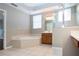 Bathroom features a corner soaking tub and shower at 13814 Nighthawk Ter, Lakewood Ranch, FL 34202