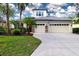 Two-story house with two-car garage and landscaping at 13814 Nighthawk Ter, Lakewood Ranch, FL 34202