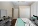 Comfortable bedroom with a dresser and a queen-size bed at 13814 Nighthawk Ter, Lakewood Ranch, FL 34202