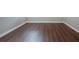 Empty bedroom with new wood-look flooring at 13814 Nighthawk Ter, Lakewood Ranch, FL 34202