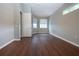 Spacious bedroom with neutral walls, wood-look flooring, and ample natural light at 13814 Nighthawk Ter, Lakewood Ranch, FL 34202