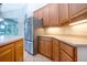 Bright kitchen with stainless steel appliances and light wood cabinets at 13814 Nighthawk Ter, Lakewood Ranch, FL 34202