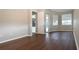 Spacious bedroom with neutral walls, wood-look flooring, and backyard access at 13814 Nighthawk Ter, Lakewood Ranch, FL 34202