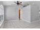 Bright living room featuring tile floors and ceiling fan at 416 Hacienda St, North Port, FL 34287