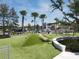 Modern playground with artificial turf and climbing structures at 416 Hacienda St, North Port, FL 34287