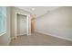 Walk-in closet with shelving and tile floors at 21281 Holmes Cir, Venice, FL 34293