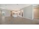 Open kitchen with white cabinets, center island, and stainless steel appliances at 21281 Holmes Cir, Venice, FL 34293