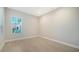 Bright bedroom with tile flooring and window at 21281 Holmes Cir, Venice, FL 34293