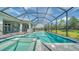 Large screened pool and spa with spacious deck at 21281 Holmes Cir, Venice, FL 34293