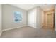 Bright bedroom featuring tile floors and double door closet at 21281 Holmes Cir, Venice, FL 34293