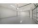 Spacious two-car garage with epoxy flooring at 21281 Holmes Cir, Venice, FL 34293