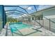 Relaxing pool and spa with a screened enclosure at 21281 Holmes Cir, Venice, FL 34293