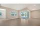 Spacious living room with access to a patio at 21281 Holmes Cir, Venice, FL 34293