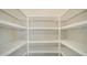 Bright walk-in pantry with ample shelving at 21281 Holmes Cir, Venice, FL 34293