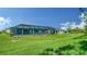 Home with a large backyard and screened pool at 21281 Holmes Cir, Venice, FL 34293