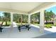 Relaxing community picnic area with shaded tables and benches, surrounded by lush landscaping at 21281 Holmes Cir, Venice, FL 34293