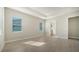Bright bedroom with tile floors and access to bathroom at 21281 Holmes Cir, Venice, FL 34293