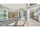 Spacious covered patio with pavers and access to the pool and kitchen at 21281 Holmes Cir, Venice, FL 34293