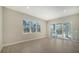 Bright Gathering room with tile floors and sliding glass doors leading to the outdoors at 21281 Holmes Cir, Venice, FL 34293