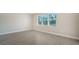 Bright bedroom with tile floors and a large window at 21281 Holmes Cir, Venice, FL 34293