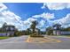 Grand Palm community entrance with palm trees at 21281 Holmes Cir, Venice, FL 34293