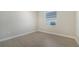Simple bedroom with tile flooring and window at 21281 Holmes Cir, Venice, FL 34293