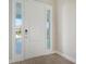 Interior entryway with white door and tile floor at 21281 Holmes Cir, Venice, FL 34293