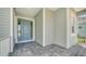 Front door entrance with paver walkway at 21281 Holmes Cir, Venice, FL 34293
