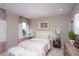 Light and airy bedroom with a comfortable bed and stylish decor at 15017 Shady Palms Ln, Nokomis, FL 34275