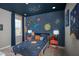 Themed bedroom with celestial wall mural and coordinating bedding at 15037 Shady Palms Ln, Nokomis, FL 34275