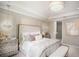 Main bedroom with en suite bathroom and sophisticated decor at 15037 Shady Palms Ln, Nokomis, FL 34275